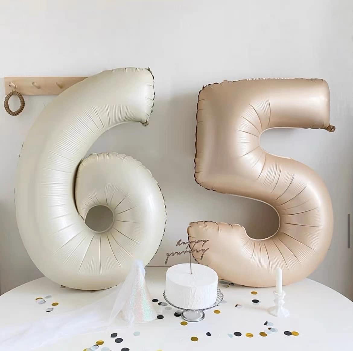 Elegant cream foil number balloon styling for an adult birthday celebration